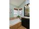 Bathroom featuring a soaking tub, and sleek fixtures at 810 Trail Ridge Dr, Louisville, CO 80027