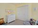 Bright Bedroom with a changing table and closet at 810 Trail Ridge Dr, Louisville, CO 80027