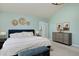 Well-lit bedroom with elegant decor, complemented by a stylish dresser and comfortable seating at 810 Trail Ridge Dr, Louisville, CO 80027