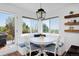 Cozy breakfast nook with built-in seating, a round table, and backyard views at 810 Trail Ridge Dr, Louisville, CO 80027
