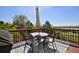Outdoor deck with dining set and views of foliage and sky at 810 Trail Ridge Dr, Louisville, CO 80027