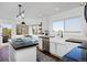 Bright and spacious kitchen with a center island, white cabinetry, and stainless-steel appliances at 810 Trail Ridge Dr, Louisville, CO 80027