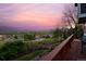 Enjoy breathtaking sunset views from this property overlooking lush greenery and distant mountains. Expansive property at 810 Trail Ridge Dr, Louisville, CO 80027