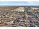 An aerial view shows a snow-dusted residential area near a golf course under a clear, bright sky at 2336 N High St, Denver, CO 80205