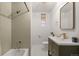 Bathroom featuring a tub, a shower, and modern fixtures at 2336 N High St, Denver, CO 80205
