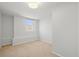 Simple and bright bedroom with window and carpet at 2336 N High St, Denver, CO 80205