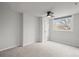 Cozy bedroom featuring a ceiling fan, window, and neutral carpet at 2336 N High St, Denver, CO 80205