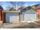 Two-car garage with white doors, providing secure parking and additional storage space at 2336 N High St, Denver, CO 80205