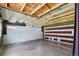 Spacious garage with an exposed ceiling and garage doors, offering ample parking or workshop space at 2336 N High St, Denver, CO 80205