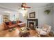Inviting living room featuring a cozy fireplace, hardwood floors, and stylish furniture arrangement at 2336 N High St, Denver, CO 80205