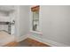 Bright living room with wooden floors, large window and open access to the kitchen at 2336 N High St, Denver, CO 80205