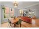 Open-concept living space with hardwood floors, dining area, and a cozy living room at 2336 N High St, Denver, CO 80205