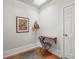 Bright office nook featuring a wooden floating desk, modern art, and a skylight for natural light at 2336 N High St, Denver, CO 80205