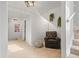 Upstairs sitting area with a comfortable armchair and a reading nook at 2336 N High St, Denver, CO 80205