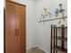 Storage room with wood shelving, wooden cabinet and pegboard with various hanging tools and tape at 2336 N High St, Denver, CO 80205