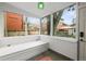 Cozy sunroom with built-in bench seating offering backyard views, perfect for relaxation at 2336 N High St, Denver, CO 80205