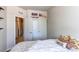 Comfortable bedroom features a closet and sports decor, showcasing a personal touch at 2346 Central Park Blvd, Denver, CO 80238