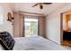 Comfortable primary bedroom with balcony access, modern decor, and neutral tones for peaceful relaxation and backyard views at 2346 Central Park Blvd, Denver, CO 80238