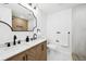 Contemporary bathroom boasting a double vanity, modern fixtures, and glass-enclosed shower at 290 Beryl Way, Broomfield, CO 80020