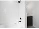 Bathroom with tub and shower featuring white subway tile at 290 Beryl Way, Broomfield, CO 80020