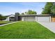 Charming home showcasing a lush lawn, sleek chimney, and convenient two-car garage at 290 Beryl Way, Broomfield, CO 80020