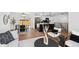 Open concept living space featuring a modern kitchen, dining area, and cozy seating at 290 Beryl Way, Broomfield, CO 80020
