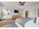 Comfortable bedroom features light walls, views of the forest, and wood-look flooring at 510 Hill Dr, Sedalia, CO 80135