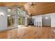 Open living area with a wood ceiling, a stone fireplace, hardwood floors, and natural light at 510 Hill Dr, Sedalia, CO 80135