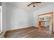 Spacious living room with wood-look floors and natural light, adjoining the open kitchen at 510 Hill Dr, Sedalia, CO 80135
