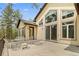 Spacious outdoor patio with outdoor seating and large windows for natural light, perfect for entertaining guests at 510 Hill Dr, Sedalia, CO 80135