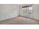 Neutral bedroom with large windows providing natural light at 9160 E Arbor Cir # F, Englewood, CO 80111