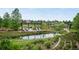 Picturesque community park with lounge seating, ponds, and lush greenery at 9160 E Arbor Cir # F, Englewood, CO 80111