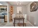 Dining area adjacent to the kitchen with a stylish light fixture at 9160 E Arbor Cir # F, Englewood, CO 80111