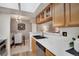 The kitchen has stainless steel appliances and light wood cabinets that open to the dining room at 9160 E Arbor Cir # F, Englewood, CO 80111