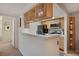 Kitchen area featuring a countertop bar with stylish cabinets and appliances at 9160 E Arbor Cir # F, Englewood, CO 80111