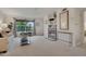 Bright living room features neutral carpet, fireplace, and large windows at 9160 E Arbor Cir # F, Englewood, CO 80111