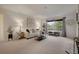 Bright living room features neutral carpet, large windows, and stylish furnishings at 9160 E Arbor Cir # F, Englewood, CO 80111