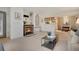 Cozy living room with fireplace, neutral carpet, and open floor plan at 9160 E Arbor Cir # F, Englewood, CO 80111
