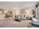 Bright living room with neutral carpet, dining area, and stylish decor at 9160 E Arbor Cir # F, Englewood, CO 80111