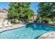 Sparkling community pool with lounge chairs for relaxing in the sun at 9160 E Arbor Cir # F, Englewood, CO 80111