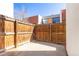 Backyard with wood privacy fence and concrete patio at 6420 E Bates Ave, Denver, CO 80222