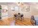 Bright dining area with hardwood floors and view into the kitchen at 6420 E Bates Ave, Denver, CO 80222