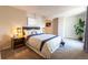 Serene main bedroom with a bed dressed in white and blue linens, complemented by stylish nightstands at 6420 E Bates Ave, Denver, CO 80222