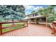 Spacious wooden deck offers a relaxing outdoor living space with stairs to a second-story balcony at 8663 E Davies Ave, Centennial, CO 80112