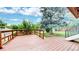 Expansive backyard wooden deck ideal for outdoor living with great lighting and view of the backyard at 8663 E Davies Ave, Centennial, CO 80112