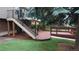 Multi-level wooden deck with stairs leading to a lush backyard, perfect for outdoor entertainment at 8663 E Davies Ave, Centennial, CO 80112