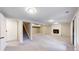 Finished basement features plush carpet, white brick fireplace, and recessed lighting at 8663 E Davies Ave, Centennial, CO 80112