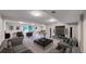 Spacious basement area perfect for relaxing and entertaining, with plush carpet and neutral tones at 8663 E Davies Ave, Centennial, CO 80112