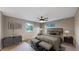 Cozy bedroom with neutral tones, ceiling fan, and an area rug at 8663 E Davies Ave, Centennial, CO 80112