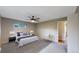 Bedroom showcasing carpet flooring, a ceiling fan, and a well-lit ambiance at 8663 E Davies Ave, Centennial, CO 80112